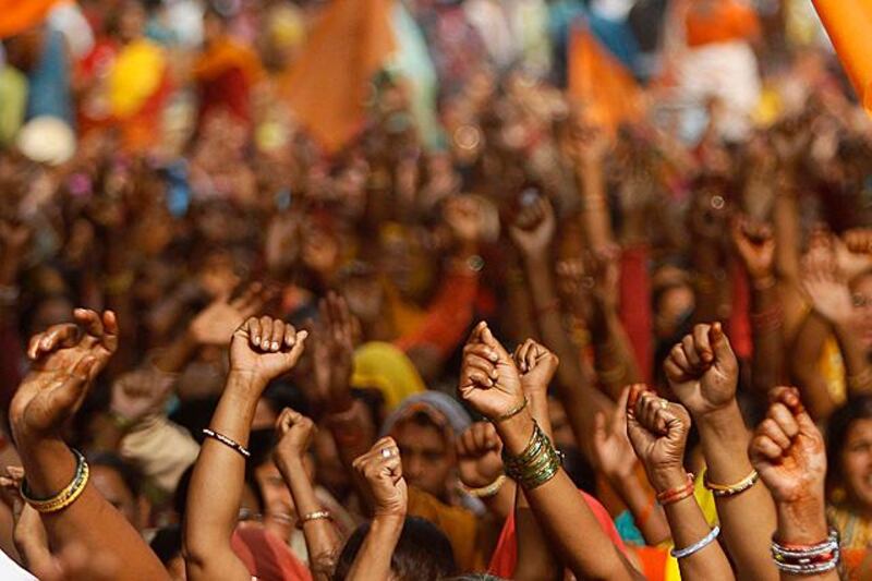 Supporters of Bharatiya Mazdoor Sangh, or Indian Workers Group, raise slogans at a protest rally in New Delhi, India, Wednesday, Nov. 23, 2011. The supporters demanded that the government protect workers rights in the ongoing economic reform process as well as the financial crisis. (AP Photo/Gurinder Osan)