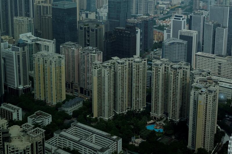 FILE PHOTO: Residential and commercial buildings are located in downtown Guangzhou, China October 7, 2017.   REUTERS/Bobby Yip/File Photo