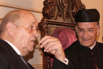 Lebanon's Christian Maronite patriarch Beshara Rai (R) meets with France's Foreign Minister Jean-Yves Le Drian in Bekerke north of Beirut on July 23, 2020. France's top diplomat was on a two-day visit to Lebanon in the first such trip in recent months by a high-ranking foreign politician to the crisis-hit country hoping for an international bailout. / AFP / -
