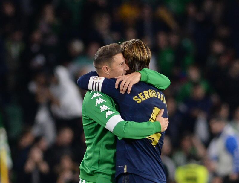 Real Betis midfielder Joaquin hugs Real Madrid defender Sergio Ramos after the final whistle. AFP