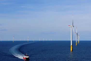 A boat sails past the DanTysk wind farm near Esbjerg, Denmark. Reuters.