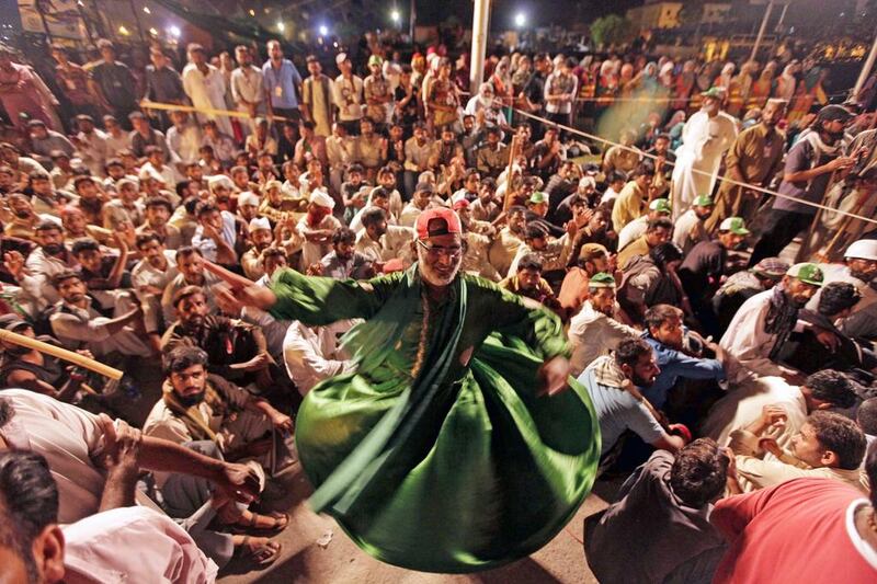 Supporters of Tahir ul Qadri, a populist cleric, listen to his speech during a mass anti-government protest in Islamabad. Bilawal Arbab / EPA