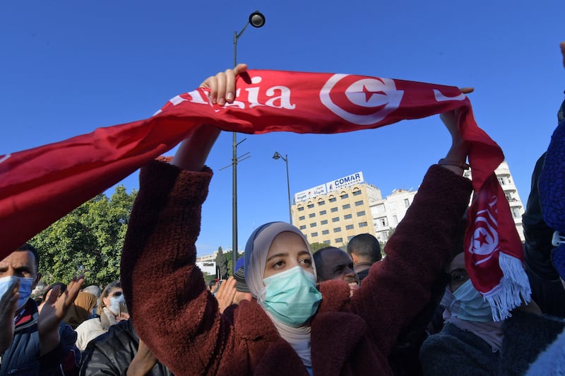 Tunisians shout slogans as they protest against President Kais Saied in the capital Tunis on the 10th anniversary of the start of the 2011 uprising. AFP
