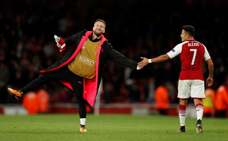 Arsenal's Shkodran Mustafi and Alexis Sanchez celebrate their victory. John Sibley / Reuters