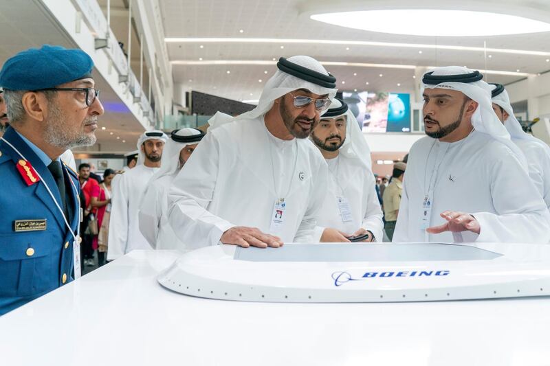ABU DHABI, UNITED ARAB EMIRATES - February 20, 2019: HH Sheikh Mohamed bin Zayed Al Nahyan, Crown Prince of Abu Dhabi and Deputy Supreme Commander of the UAE Armed Forces (2nd L) visits Boeing stand, during the 2019 International Defence Exhibition and Conference (IDEX), at Abu Dhabi National Exhibition Centre (ADNEC). Seen with HE Major General Essa Saif Al Mazrouei, Deputy Chief of Staff of the UAE Armed Forces (L).

( Rashed Al Mansoori / Ministry of Presidential Affairs )
---