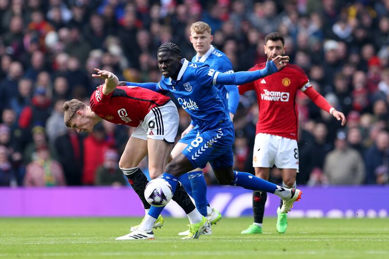Amadou Onana of Everton battles for possession with Scott McTominay of Manchester United. Getty Images
