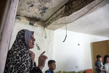 Palestinian mother-of-six Nisreen Awada, 35, inside her crumbling concrete home in Wadi Hilweh in Silwan, a contested neighbourhood right beyond the Old City's walls in Jerusalem. Heidi Levine for The National