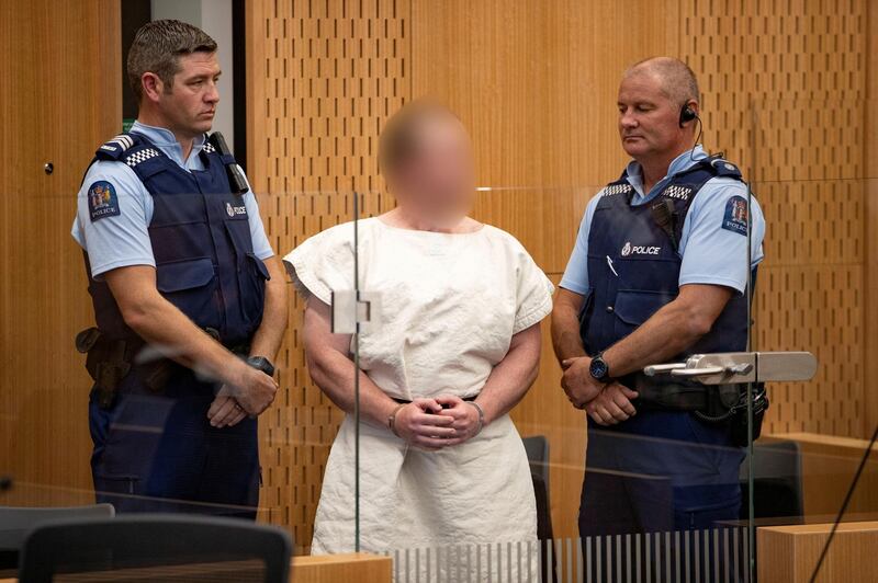 FILE PHOTO - Brenton Tarrant, charged for murder in relation to the mosque attacks, is seen in the dock during his appearance in the Christchurch District Court, New Zealand March 16, 2019.   Mark Mitchell/New Zealand Herald/Pool via REUTERS/File Photo   ATTENTION EDITORS - PICTURE PIXELATED AT SOURCE. SUSPECT FACE MUST BE PIXELATED. ONLY HIS FACE.