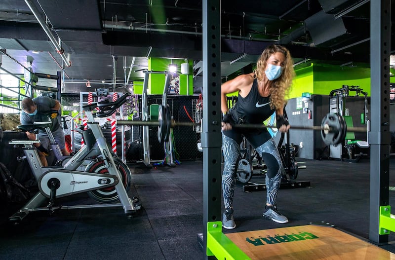 Abu Dhabi, United Arab Emirates, July 1, 2020.   Fitness buff, Natalie Navikova pumps some iron at Cobra Fitness Abu Dhabi at Al Bandar.
Victor Besa  / The National
Section:  NA 
Reporter:  Haneen Dajani