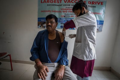 A man receives a third dose of the Covid-19 vaccine in Gauhati, India, in April 2022. AP Photo


