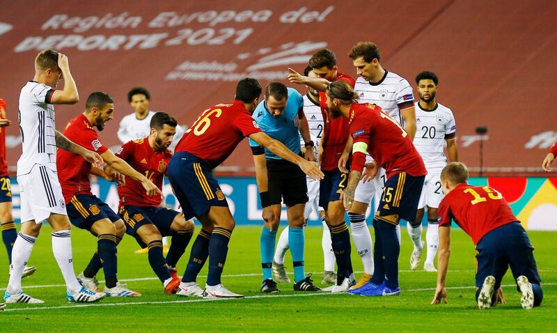 Spain's Sergio Ramos and Rodri remonstrate with the referee. Reuters