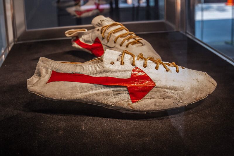 The pair of track and field spikes designed by Bill Bowerman for Canadian sprinter Harry Jerome features a red arrow that was a prelude to the famous Nike swoosh logo. Sotheby's via AFP