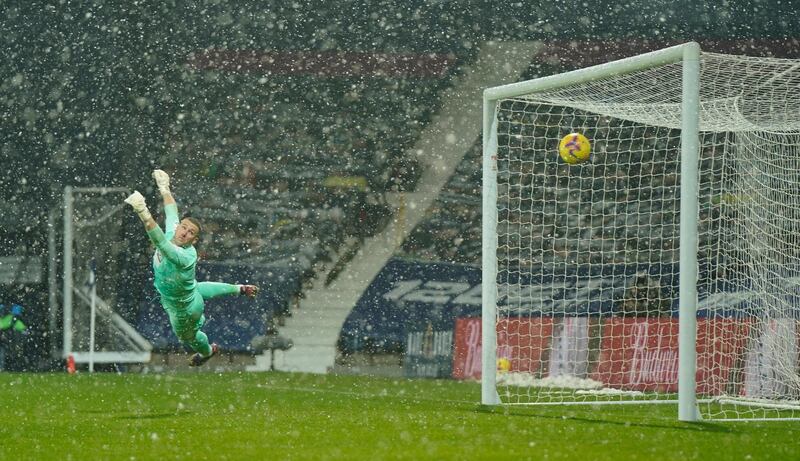 West Bromwich Albion goalkeeper Sam Johnstone cannot stop Arsenal's Kieran Tierney opening the scoring during his team's 4-0 Premier League defeat at a snowy Hawthorns on Saturday, January 3. Reuters