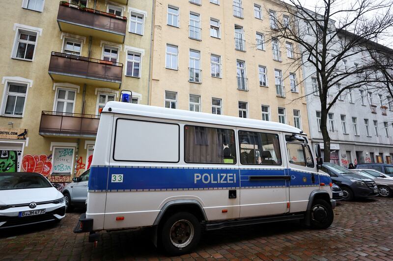 A German police vehicle is parked in front an apartment in Berlin during the raids. Reuters
