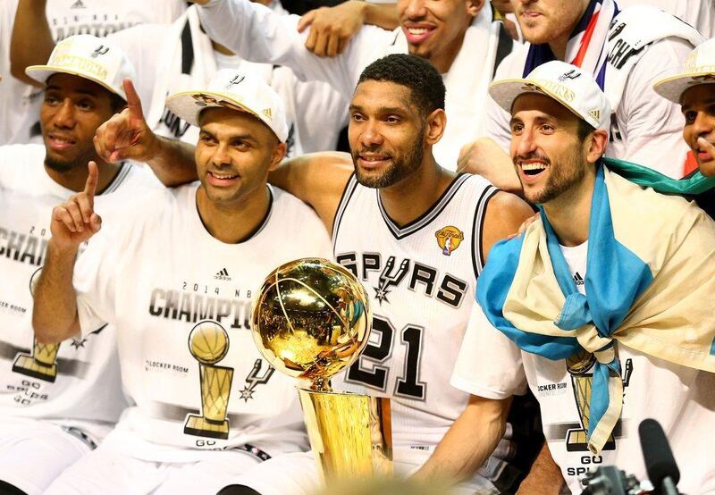 San Antonio Spurs’ big three; Tony Parker, Tim Duncan and Manu Ginobili celebrate defeating the Miami Heat in Game Five of the 2014 NBA Finals. Andy Lyons / Getty Images / AFP