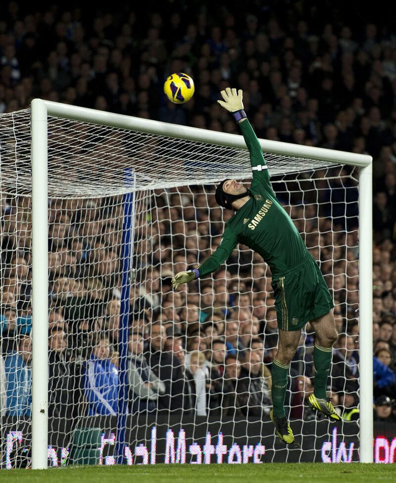 Chelsea's Czech goalkeeper Petr Cech jumps to make a save during the English Premier League football match between Chelsea and Manchester United at Stamford Bridge in London, on October 28, 2012. Manchester United won the game 3-2. AFP PHOTO/ADRIAN DENNIS

RESTRICTED TO EDITORIAL USE. No use with unauthorized audio, video, data, fixture lists, club/league logos or “live” services. Online in-match use limited to 45 images, no video emulation. No use in betting, games or single club/league/player publications.
 *** Local Caption ***  773526-01-08.jpg