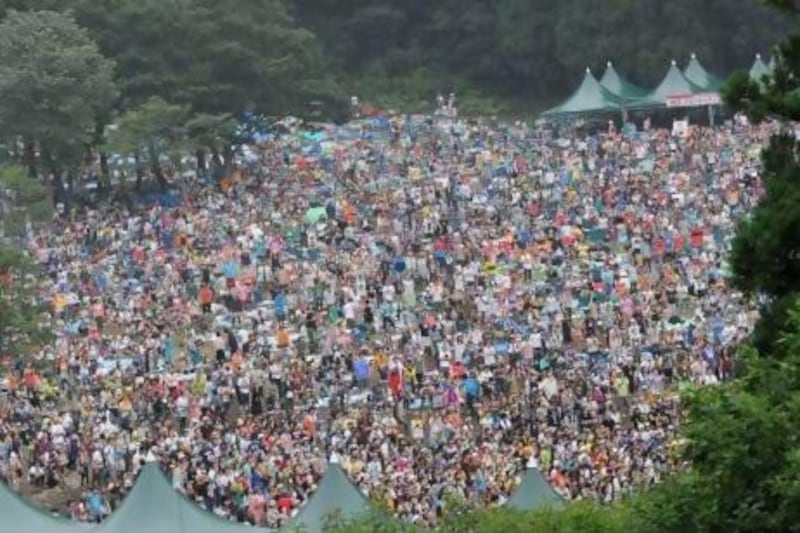 Crowds fill a forest in the Japanese resort of Naeba for the 2010 edition of Fuji Rock Festival. Diva Zappa / Corbis