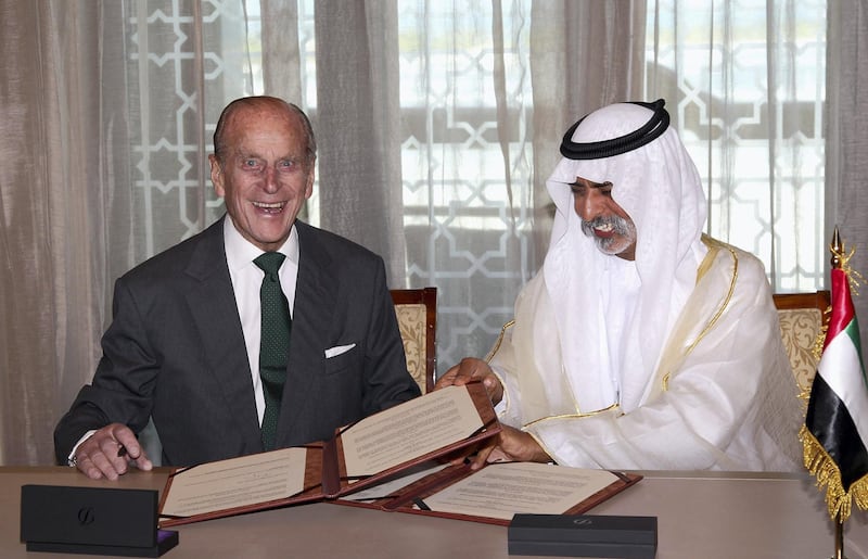 ABU DHABI, UNITED ARAB EMIRATES - NOVEMBER 25:  Prince Philip, Duke of Edinburgh signs a memorandum of understanding between Cambridge University Judge Business School and the University of the UAE for Teaching and Research in the Further Development of Abu Dhabi withSheikh Nahyan bin Mubarak Emirates Palace on November 25, 2010 in Abu Dhabi, United Arab Emirates. Queen Elizabeth II and Prince Philip, Duke of Edinburgh are in Abu Dhabi on a State Visit to the Middle East. The Royal couple will spend two days in Abu Dhabi and three days in Oman.  (Photo by Chris Jackson/Getty Images)