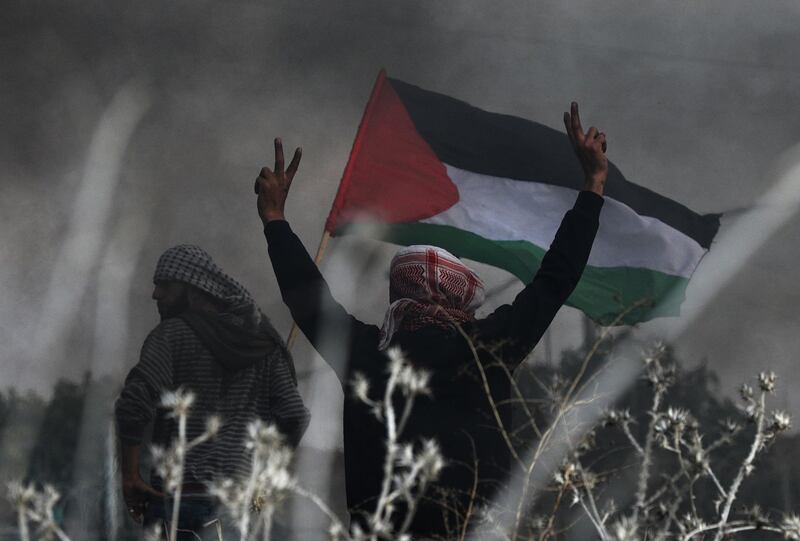 Palestinian protesters gesture during clashes with Israeli soldiers amidst a protest organised to show opposition to the US President's decision to recognise Jerusalem as the capital of Israel. Mohammed Saber / EPA
