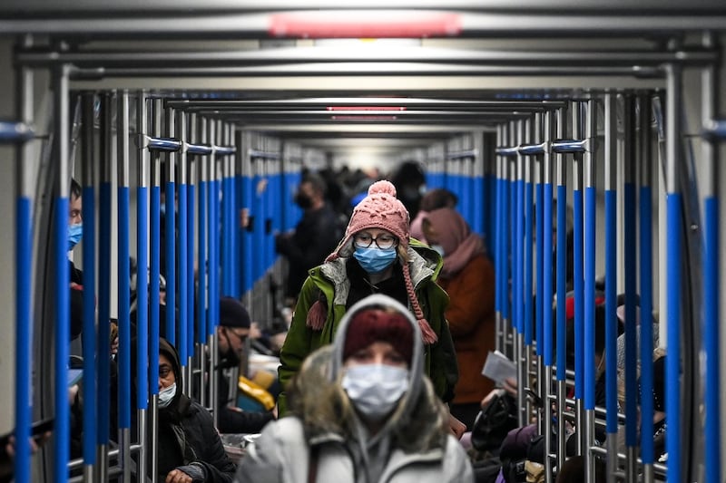 A woman wearing a face mask to protect against the coronavirus disease rides in a metro train in Moscow. Russia confirmed 26,190 new Covid-19 cases on December 9.  AFP
