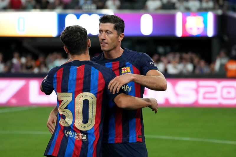 Robert Lewandowski and Gavi during the pre-season game between Barcelona and Real Madrid. EPA
