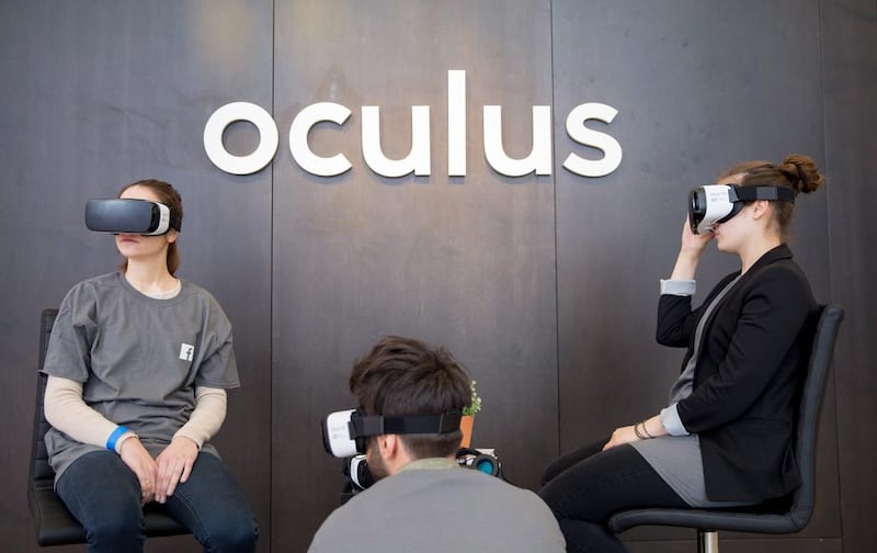 People try out the virtual reality glasses by Oculus at the Facebook Innovation Hub in Berlin. Kay Nietfeld / EPA 

