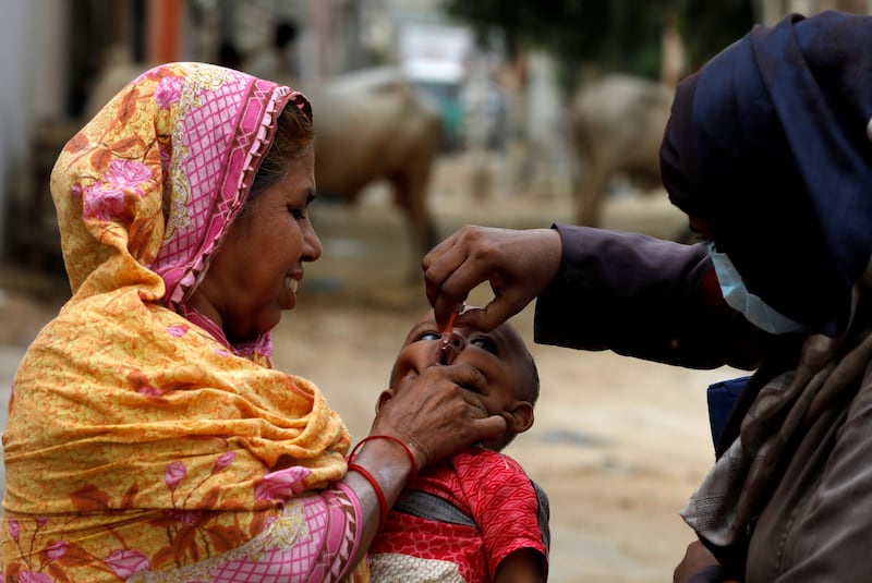 A boy receives polio vaccine drops in Karachi. Reuters