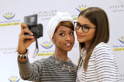 A handout photo of Zendaya and a fan at Dubai Summer Surprises in Dubai (Courtesy: Dubai Festivals and Retail Establishment) *** Local Caption ***  BLOG31au-dss-zendaya02.jpeg