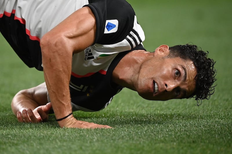 Cristiano Ronaldo falls on the pitch. AFP