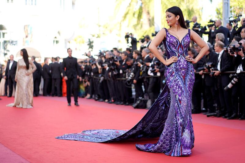 Rai Bachchan's gown consists of ultra-violet, midnight blue, and red threadwork and is meant to mimic a butterfly emerging from its chrysalis. EPA
