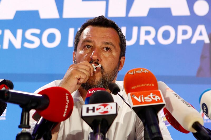 Italian Deputy Prime Minister and leader of far-right League party Matteo Salvini kisses a crucifix as he speaks during his European Parliament election night event in Milan, Italy. Reuters