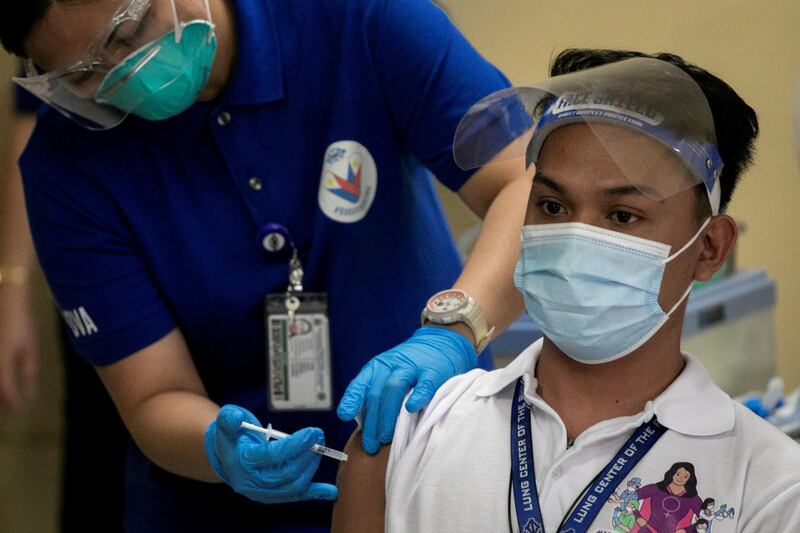 A health worker gets vaccinated with Sinovac Biotech's Coronavac on the first day of the COVID-19 inoculation drive in the Philippines. Reuters