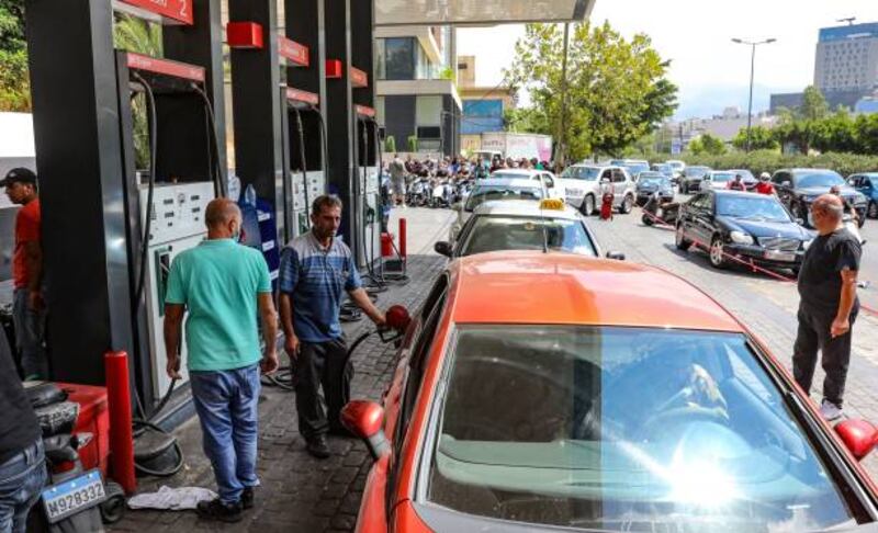 Drivers queue in front of a petrol station in the Lebanese capital Beirut. Fuel and utility prices remain a sensitive issue for political and social stability in the country facing its worst post-war economic crisis. Getty Images