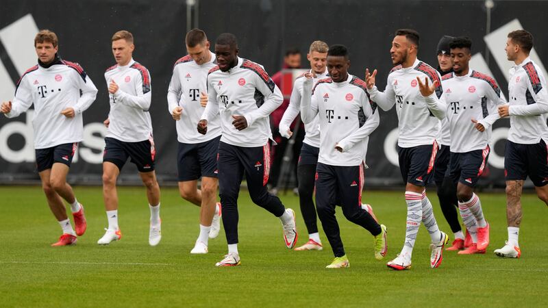 Bayern Munich players warm up for a training session. AP Photo