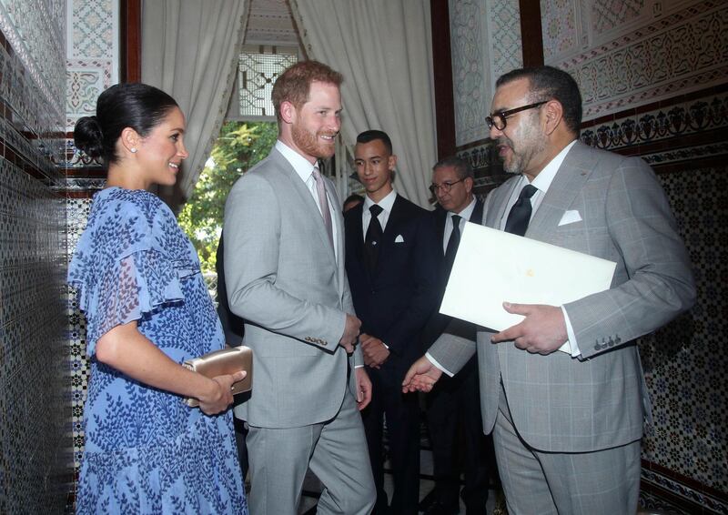 Prince Harry and Meghan, the Duchess of Sussex, are greeted by King Mohammed VI of Morocco, at his residence, on the third and final day of their tour of Morocco. AP