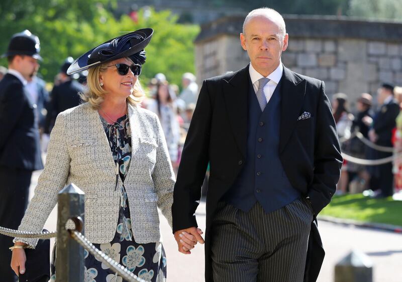 Former England rubby coach Clive Woodward and Jayne Williams arrive for the wedding ceremony of Britain's Prince Harry and  Meghan Markle at St George's Chapel, Windsor Castle, in Windsor. Gareth Fuller / AFP