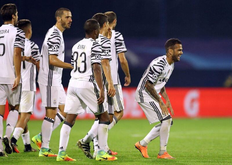 Juventus’ Dani Alves celebrates after scoring a goal against Dinamo Zagreb. AFP