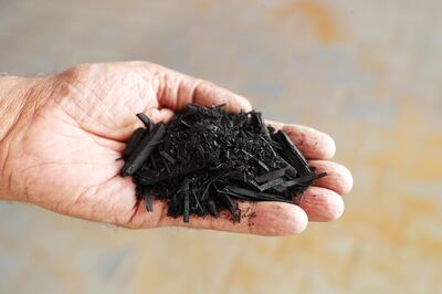 Biochar made from palm leaves that have been pyrolysed. Chris Whiteoak / The National