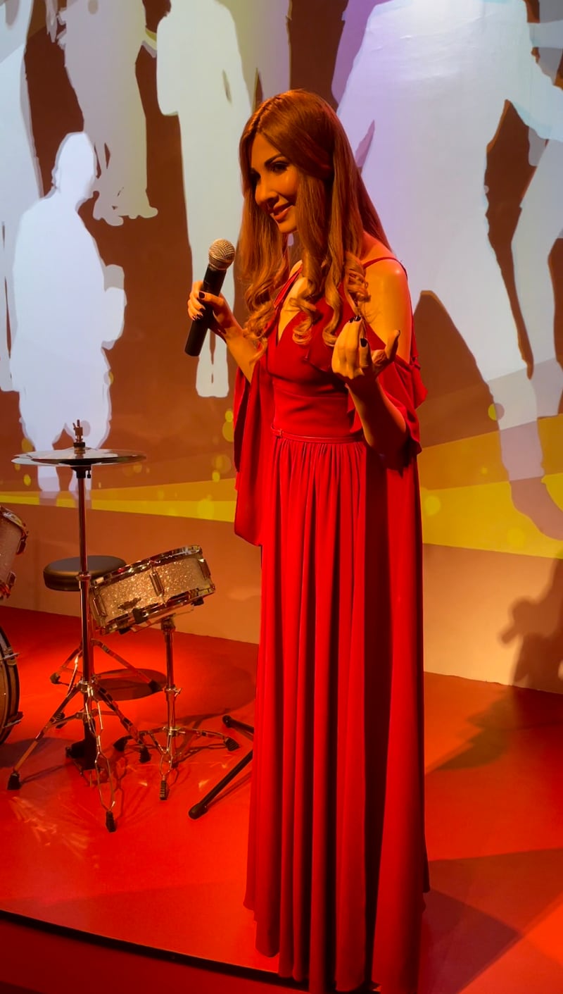 Guests can pose on a drum set next to Lebanese pop star Nancy Ajram