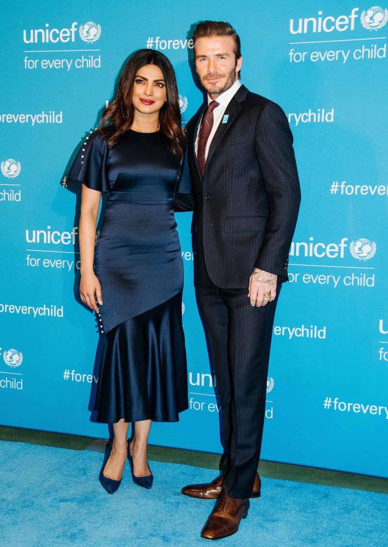 epa05673407 British soccer player and UNICEF Goodwill Ambassador David Beckham (R) and Indian singer and actress Priyanka Chopra attend the 70th UNICEF Anniversary at the United Nations Headquarters in New York, New York, USA, 12 December 2016. UNICEF commemorates 70 years of work for children with the help of some of the organization's best-known Goodwill Ambassadors and celebrity advocates.  EPA/ALBA VIGARAY