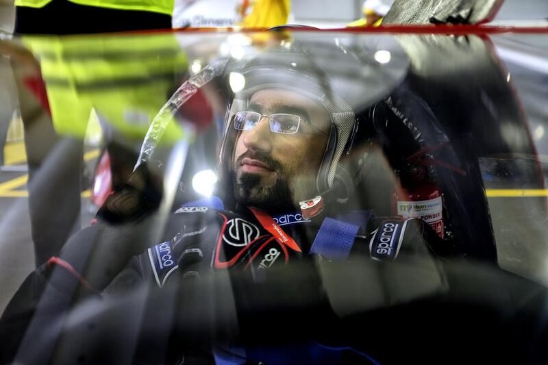 Driver Kalifa Alhamari, 24,  a participant from the UAE, gets his car inspected and fitted before the morning practive sessions of the Shell Eco Marathon in Manila Philippines. Jes Aznar for The National