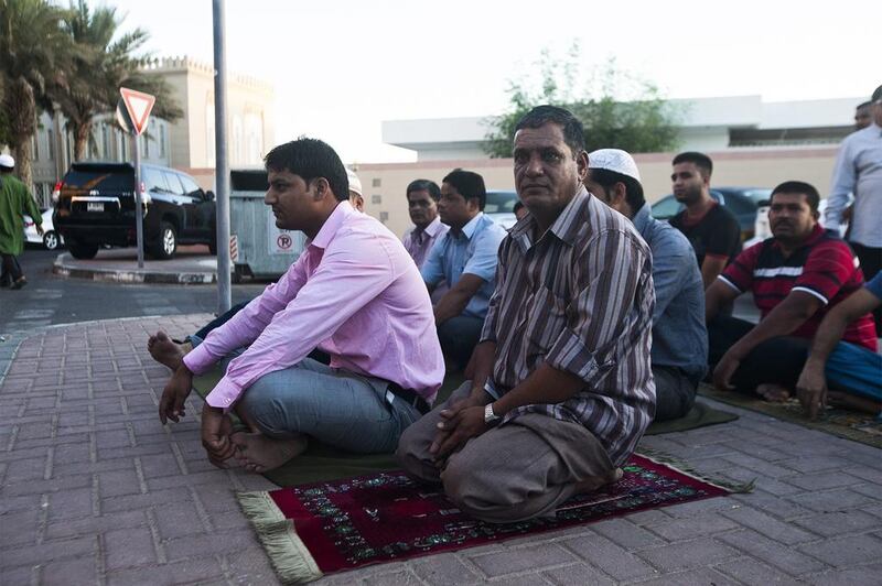 Seen here is Yasin, of Bangladesh, right before beginning his prayers at the Jumeirah Mosque. Lee Hoagland/The National