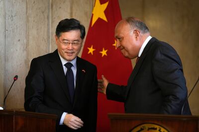 Egyptian Foreign Minister Sameh Shoukry, right, and Chinese counterpart Qin Gang in Cairo. AP