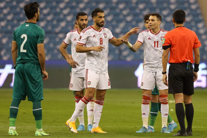 UAE midfielder Majed Hassan and forward Caio Canedo argue with Chinese referee Ma Ning during the 2022 Qatar World Cup Group A qualifier against Iraq at the King Fahd International stadium in Riyadh, on Thursday, March 24, 2022. AFP