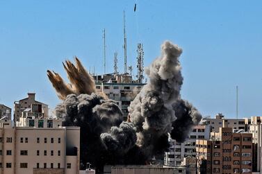 An Israeli air strike destroys the builiding housing the offices of The Associated Press. AFP via AP