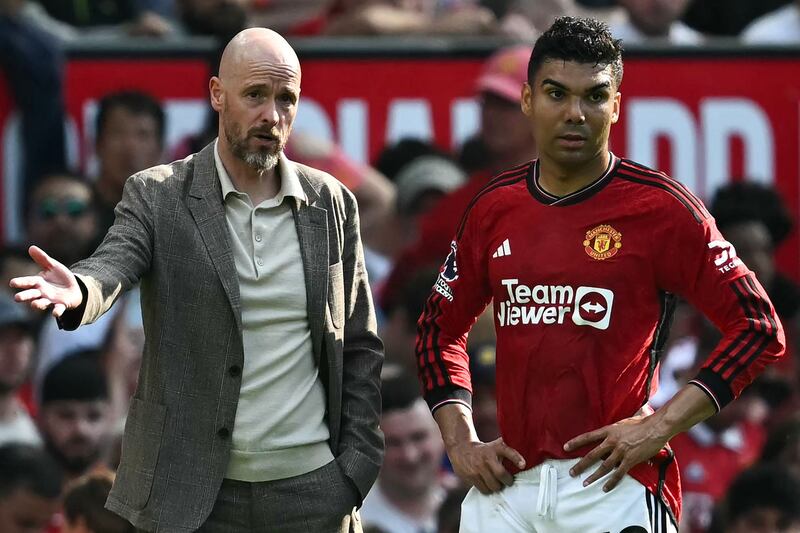 Manchester United manager Erik ten Hag talks to Casemiro during the match. AFP