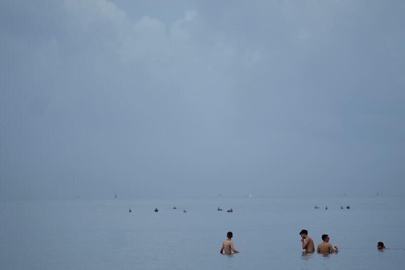 Swimmers in the ocean off Crandon Park in Key Biscayne, Florida. When water temperatures get too high, some of the appeal of swimming is lost. AP