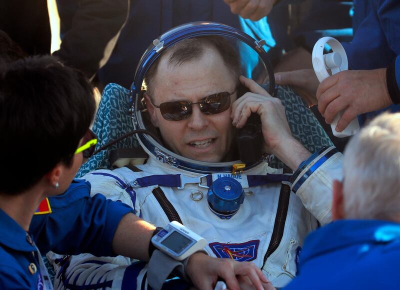 US astronaut Nick Hague calls his relatives. AP Photo