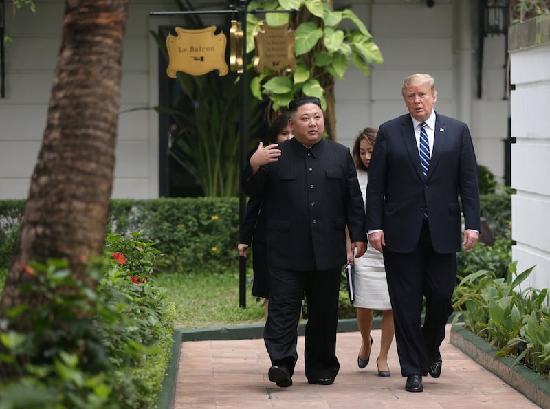 Kim Jong Un and Donald Trump talk in the garden of the Metropole hotel. Reuters