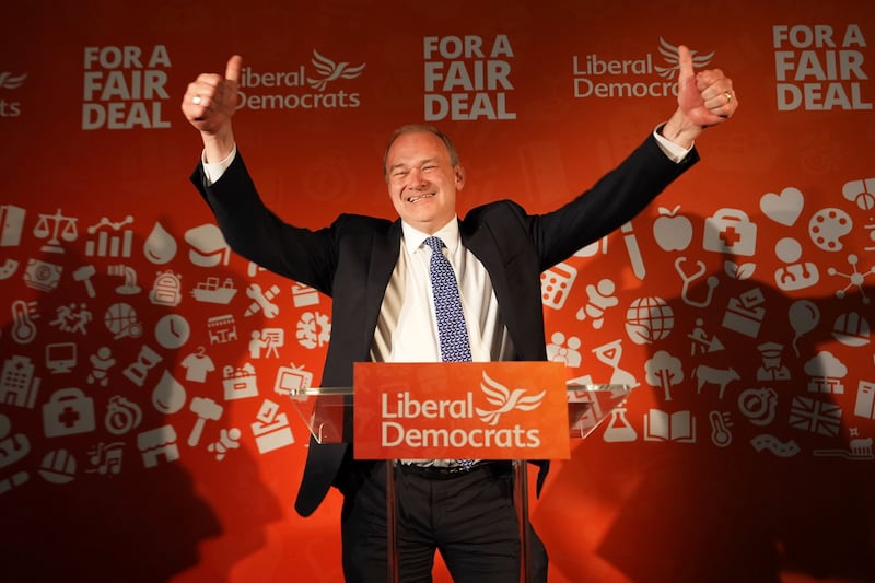 Liberal Democrat leader Ed Davey celebrates at London Art Bar, central London, after his party seemed poised for a successful night. AP